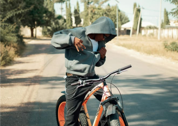 A rider enjoying a ZestRyde bike on a sunny street
